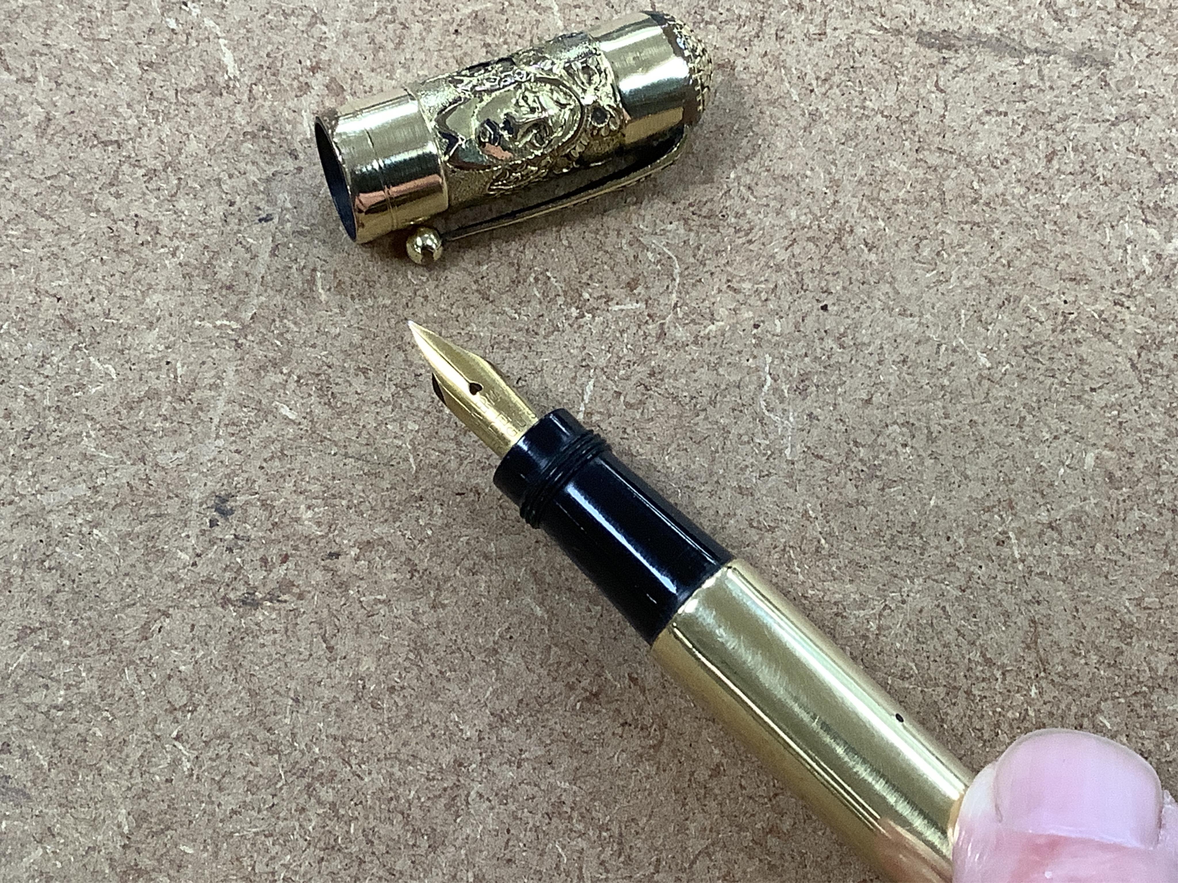 A Waterman No.42 'continental' safety with un unusual highly decorated cap top depicting female faces